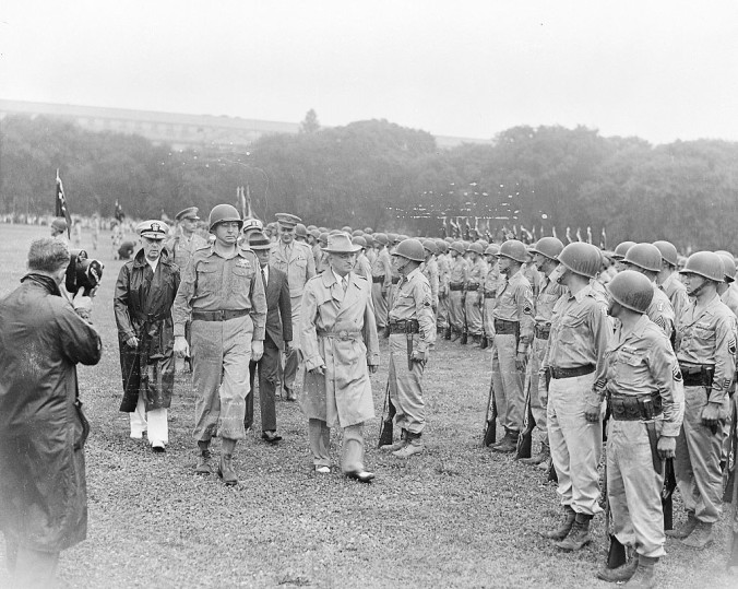 President Truman walking past members of the Nisei 442nd Regimental Combat Team as they stand at attention on the Ellipse., 15 July 1946